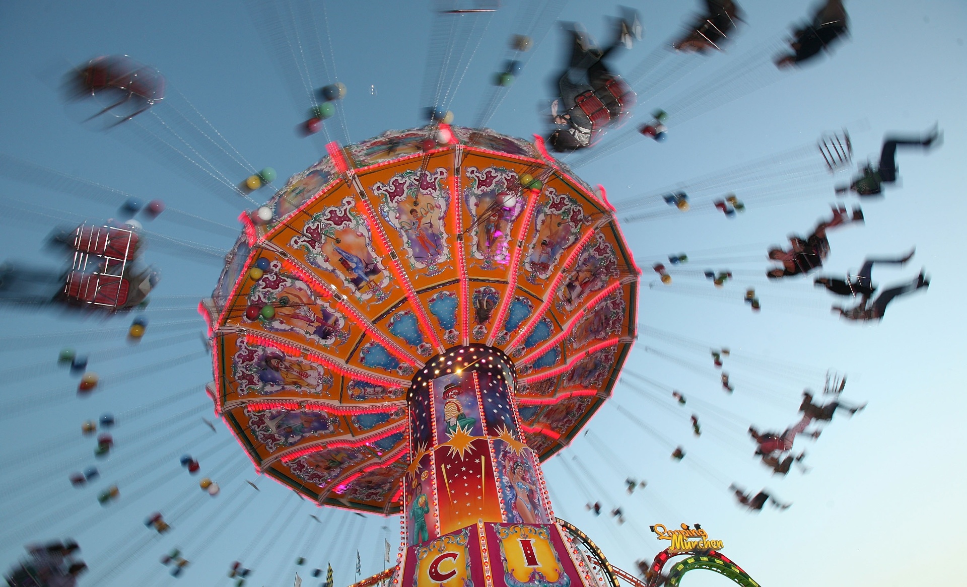 Oktoberfest chairoplane ride at dusk in Munich